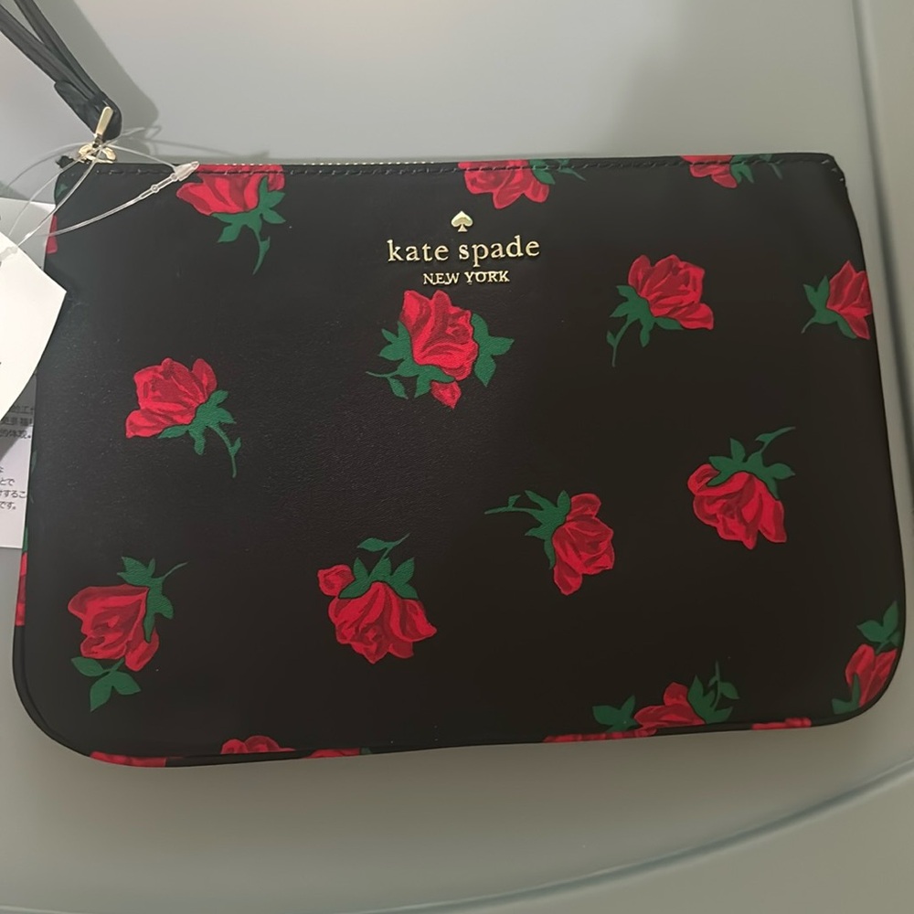 NWT Kate Spade medium wristlet in rose pattern